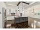Gourmet kitchen features stainless appliances, center island, and custom backsplash at 1015 143Rd Ne St, Bradenton, FL 34212