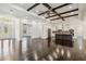 Expansive open-concept living space with hardwood floors and seamless flow to the kitchen at 1015 143Rd Ne St, Bradenton, FL 34212