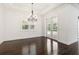 Bright living room featuring a chandelier and French doors leading to the pool at 1015 143Rd Ne St, Bradenton, FL 34212