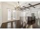 Open-concept living room with hardwood floors flowing into the kitchen at 1015 143Rd Ne St, Bradenton, FL 34212