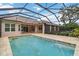 Screened swimming pool and patio with tiled floor at 1015 143Rd Ne St, Bradenton, FL 34212