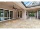 Tiled floor in covered porch with ceiling fan and sliding glass doors at 1015 143Rd Ne St, Bradenton, FL 34212