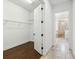 Walk-in closet with wire shelving featuring an open view to the ensuite bathroom, complete with shower and tub at 1015 143Rd Ne St, Bradenton, FL 34212