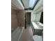 Bathroom with a bathtub, sink, and a skylight providing natural light at 1036 Arden Nw Ter, Port Charlotte, FL 33948