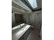 Bathroom featuring a bathtub and vanity sink, brightened by a skylight overhead at 1036 Arden Nw Ter, Port Charlotte, FL 33948