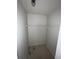 A small walk-in closet with carpet, wire shelving, and white walls at 1036 Arden Nw Ter, Port Charlotte, FL 33948