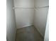 A small walk-in closet with carpet, white walls, and a wire rack at 1036 Arden Nw Ter, Port Charlotte, FL 33948