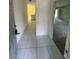 Tiled entryway leading to the kitchen and living room at 1036 Arden Nw Ter, Port Charlotte, FL 33948