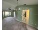 The living room leads to the kitchen in this home at 1036 Arden Nw Ter, Port Charlotte, FL 33948