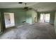 A living room with a fan, and entryway at 1036 Arden Nw Ter, Port Charlotte, FL 33948