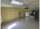 Bright living room with fan, skylight, and access to lanai at 1036 Arden Nw Ter, Port Charlotte, FL 33948