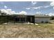A backyard swimming pool with screened enclosure provides outdoor enjoyment at 1036 Arden Nw Ter, Port Charlotte, FL 33948