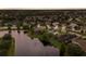 An aerial view showcasing a neighborhood with waterfront homes, lush landscaping and scenic ponds at 12015 Forest Park Cir, Bradenton, FL 34211