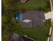 Aerial view of the home, pool area, well-maintained yard, and surrounding landscaping at 12015 Forest Park Cir, Bradenton, FL 34211
