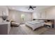 Inviting bedroom featuring a plush bed, chair, and natural light from a window at 12015 Forest Park Cir, Bradenton, FL 34211