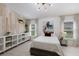 Comfortable bedroom with decorative wood wall, large window, and decorative art at 12015 Forest Park Cir, Bradenton, FL 34211