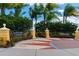 Inviting entrance to Central Park featuring decorative pillars, landscaping and a park bench at 12015 Forest Park Cir, Bradenton, FL 34211