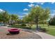 A lovely community park offers walking paths, benches, green spaces, and playground perfect for outdoor activities at 12015 Forest Park Cir, Bradenton, FL 34211