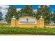 A welcoming community sign for Central Park at Lakewood Ranch amid lush greenery and a serene lake backdrop at 12015 Forest Park Cir, Bradenton, FL 34211