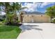 Inviting home with a well-manicured lawn and a spacious three-car garage at 12015 Forest Park Cir, Bradenton, FL 34211