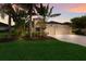 Beautifully landscaped single-Gathering home featuring a two-car garage and tropical landscaping at 12015 Forest Park Cir, Bradenton, FL 34211