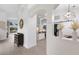 Open-concept foyer with wood-look flooring, modern decor, and a view of the home's living spaces at 12015 Forest Park Cir, Bradenton, FL 34211