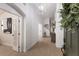 Bright and airy foyer featuring a stylish light fixture, wood-look floors, and a view of the home's interior at 12015 Forest Park Cir, Bradenton, FL 34211