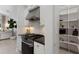 Well-equipped kitchen with a modern range, granite countertop, and bright pantry at 12015 Forest Park Cir, Bradenton, FL 34211