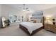 This is a main bedroom suite with vaulted ceiling, neutral decor, and large window with shutters at 12015 Forest Park Cir, Bradenton, FL 34211