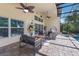 Screened-in patio with outdoor seating, overlooking the pool and backyard at 12015 Forest Park Cir, Bradenton, FL 34211