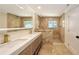 Modern bathroom with stylish double sinks, decorative tile, and shower at 1203 Lyric Ln, Sarasota, FL 34242