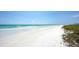 Wide view of the white sands and emerald waters of Siesta Key Beach on a bright sunny day at 1203 Lyric Ln, Sarasota, FL 34242
