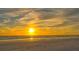 Beautiful sunset over the water with birds flying above the beach at 1203 Lyric Ln, Sarasota, FL 34242