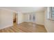 Cozy bedroom with wood floors and access to an ensuite bathroom at 1203 Lyric Ln, Sarasota, FL 34242