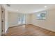 Well-lit bedroom showcasing wood floors, french doors, and a window at 1203 Lyric Ln, Sarasota, FL 34242