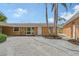 Beautiful home featuring a meticulously maintained yard with a curved walkway to the front door at 1203 Lyric Ln, Sarasota, FL 34242