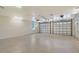 Spacious two-car garage with modern lighting and an epoxy floor at 1203 Lyric Ln, Sarasota, FL 34242