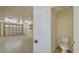 Spacious garage with epoxy flooring, bright lighting, and convenient half bathroom at 1203 Lyric Ln, Sarasota, FL 34242