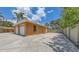 This is a detached garage featuring multiple bays and a large driveway at 1203 Lyric Ln, Sarasota, FL 34242
