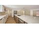Bright, open kitchen with stainless steel appliances, large island, and modern countertops at 1203 Lyric Ln, Sarasota, FL 34242