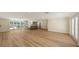 Spacious living room featuring modern flooring, recessed lighting, and large windows at 1203 Lyric Ln, Sarasota, FL 34242