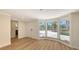 Living room featuring a bay window, a doorway, and wood floors at 1203 Lyric Ln, Sarasota, FL 34242