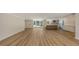 Large open living area featuring modern flooring, recessed lighting, and a kitchen at 1203 Lyric Ln, Sarasota, FL 34242
