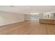 Expansive open-concept living space with hardwood floors and recessed lighting with natural light at 1203 Lyric Ln, Sarasota, FL 34242