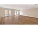 Bright living room featuring hardwood floors, recessed lighting and access to the backyard at 1203 Lyric Ln, Sarasota, FL 34242