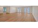 Bright living room with wood floors and french doors leading to the yard at 1203 Lyric Ln, Sarasota, FL 34242