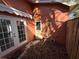 Backyard patio with canopy, french doors, outdoor shower and landscaping at 13017 Club Dr, Hudson, FL 34667