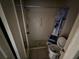 Bathroom with toilet and a shower with blue curtain, ready to be renovated at 13017 Club Dr, Hudson, FL 34667