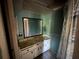 Bathroom with vanity, large mirror, and shower at 13017 Club Dr, Hudson, FL 34667