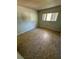 Bedroom with neutral paint and tile flooring at 13017 Club Dr, Hudson, FL 34667
